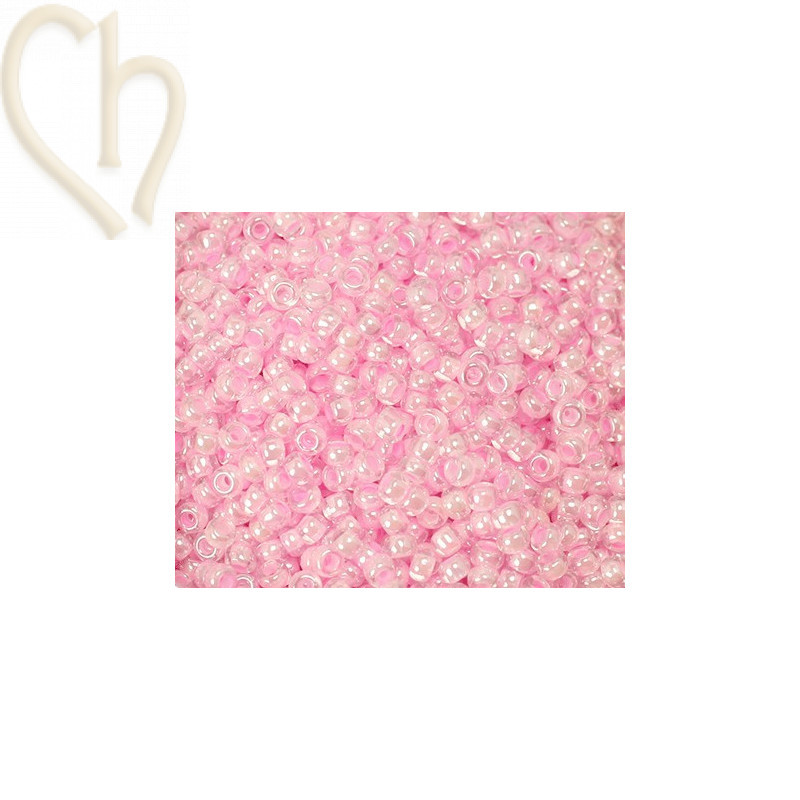 Rocaille 11/0 rose bonbon transparant